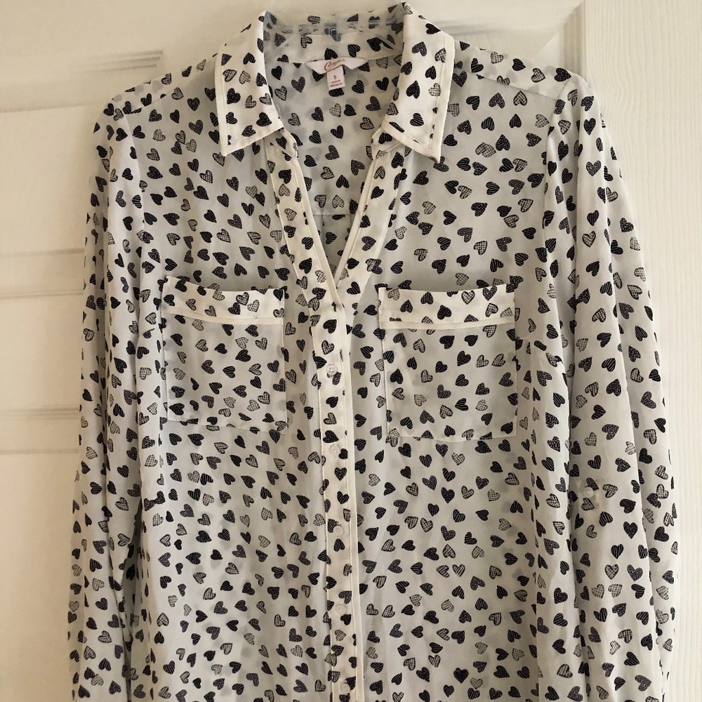 Long Sleeve button down blouse with hearts pattern.